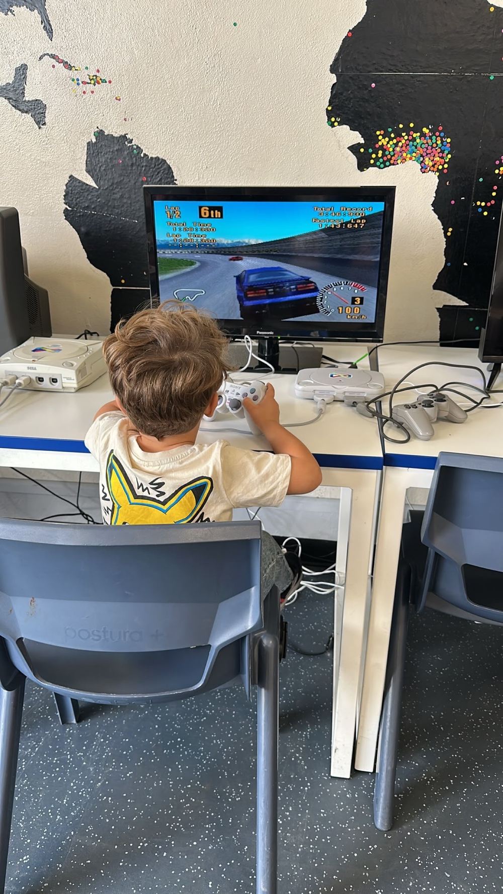 A child playing a racing game on a retro console